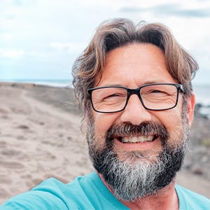 man in front of beach photo