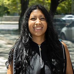 woman standing in front of park